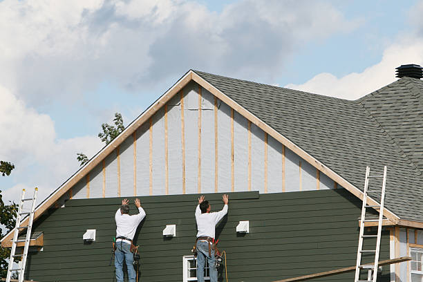Professional Siding technician working in Wheaton, MD